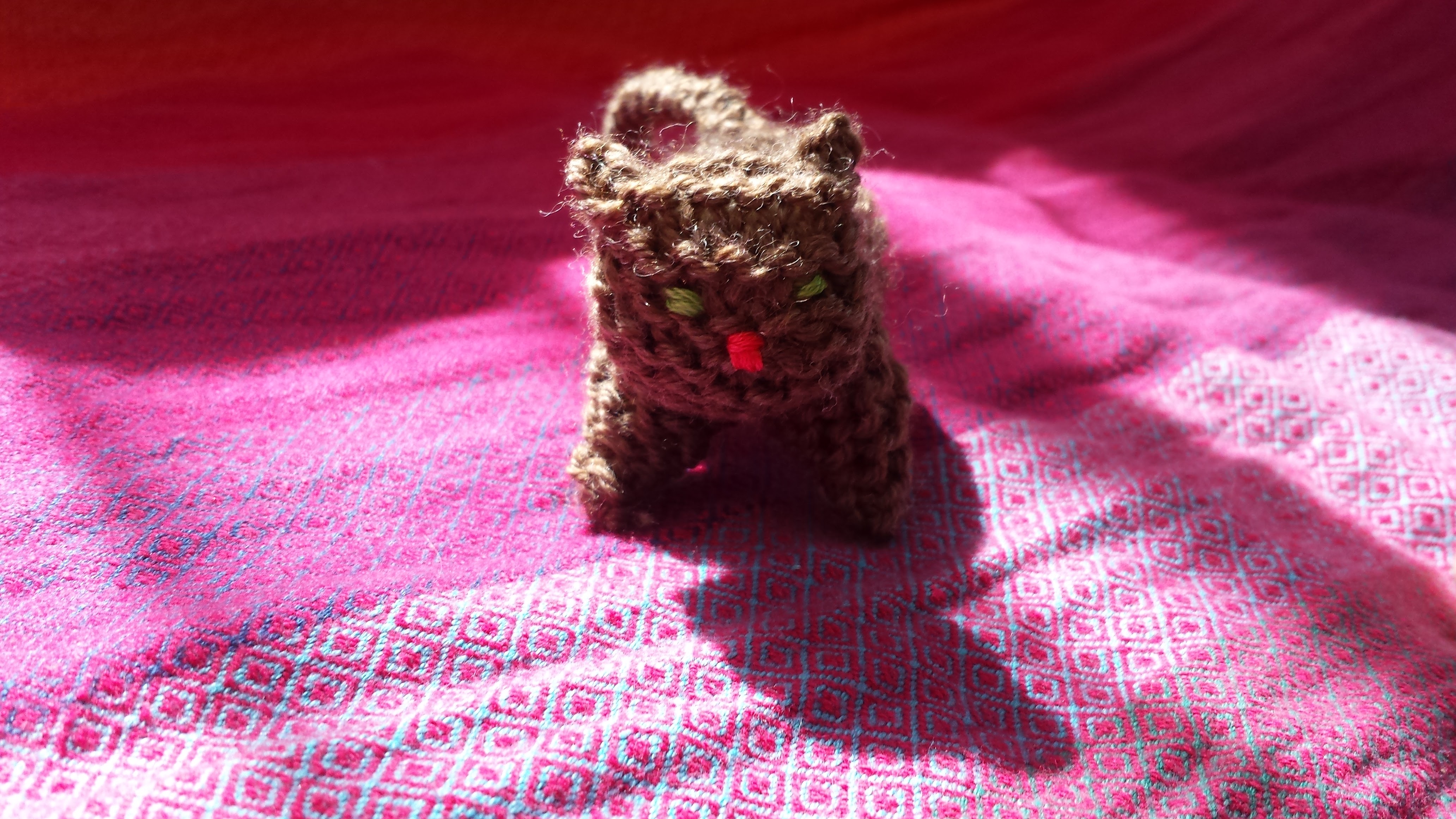 Knitted cat, front view